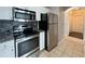 Stainless steel appliances including a refrigerator, microwave, and oven at 1850 Cotillion Dr # 2416, Atlanta, GA 30338