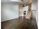 Spacious living room featuring hardwood floors, a staircase, and neutral paint at 1850 Cotillion Dr # 2416, Atlanta, GA 30338