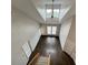Bright living room featuring vaulted ceilings, skylight, fan, and hardwood floors at 1850 Cotillion Dr # 2416, Atlanta, GA 30338