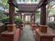 Inviting walkway with brick columns supporting an overhead pergola amidst manicured greenery at 1850 Cotillion Dr # 2416, Atlanta, GA 30338