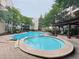 Inviting pool area with a hot tub, surrounded by lounge chairs at 1850 Cotillion Dr # 2416, Atlanta, GA 30338