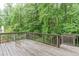 A back deck overlooks lush greenery and offers plenty of outdoor living space at 2122 Rockland Ct, Marietta, GA 30062