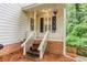 Charming back porch with brick foundation and privacy from the wooded yard at 2122 Rockland Ct, Marietta, GA 30062