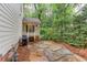 Charming backyard patio with stone pavers, perfect for entertaining or relaxing in the wooded setting at 2122 Rockland Ct, Marietta, GA 30062