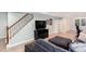 Finished basement featuring a comfortable sitting area, TV, staircase, and built-in shelving at 2122 Rockland Ct, Marietta, GA 30062