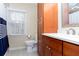 Bathroom features white marble countertop, wood cabinets, and large window at 2122 Rockland Ct, Marietta, GA 30062