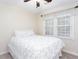 Bedroom featuring a queen sized bed and large window with shade at 2122 Rockland Ct, Marietta, GA 30062