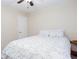 Bedroom featuring a queen sized bed, ceiling fan and door at 2122 Rockland Ct, Marietta, GA 30062