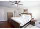 Comfortable bedroom featuring hardwood floors, a ceiling fan, and neutral walls at 2122 Rockland Ct, Marietta, GA 30062