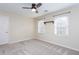 Bright, neutral bedroom features a ceiling fan and two windows with blinds at 2122 Rockland Ct, Marietta, GA 30062