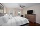 Bedroom with a large dresser, hardwood floors, and a large TV at 2122 Rockland Ct, Marietta, GA 30062