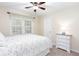 Bedroom featuring a queen sized bed and large window with shade at 2122 Rockland Ct, Marietta, GA 30062