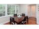 Bright breakfast nook featuring a square table and large windows overlooking a peaceful outdoor view at 2122 Rockland Ct, Marietta, GA 30062