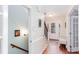 Bright entryway featuring hardwood floors, a white front door, and staircase with wrought iron railing at 2122 Rockland Ct, Marietta, GA 30062