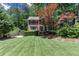 Well-maintained two-story brick home with lush green lawn and basketball hoop at 2122 Rockland Ct, Marietta, GA 30062