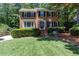 Classic two-story brick home with black shutters and a well-kept lawn at 2122 Rockland Ct, Marietta, GA 30062