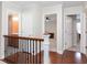 Upstairs hallway with hardwood floors and access to bedrooms and a bathroom at 2122 Rockland Ct, Marietta, GA 30062
