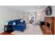Bright living room features a fireplace, a large window, hardwood floors, and comfortable seating at 2122 Rockland Ct, Marietta, GA 30062