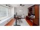 Bright home office with hardwood floors, large window, custom built-ins, and a ceiling fan at 2122 Rockland Ct, Marietta, GA 30062