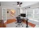 Well-lit office with hardwood floors, large window, and access through stylish french doors at 2122 Rockland Ct, Marietta, GA 30062