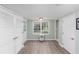 Bright room with LVP flooring, lots of windows, storage, and fresh neutral paint at 2122 Rockland Ct, Marietta, GA 30062