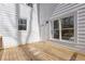 Wooden deck with views of the home's exterior, including white siding and windows at 2453 Paul Nw Ave, Atlanta, GA 30318