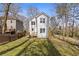 Backyard view of the two-story home with a grassy lawn at 2453 Paul Nw Ave, Atlanta, GA 30318