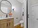 Bathroom featuring modern vanity with hardwood flooring and glass shower at 2453 Paul Nw Ave, Atlanta, GA 30318