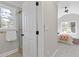 Bathroom and bedroom featuring a doorway with a glass door shower at 2453 Paul Nw Ave, Atlanta, GA 30318