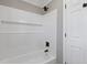 Bathroom showing a tiled tub and shower combo featuring black hardware at 2453 Paul Nw Ave, Atlanta, GA 30318