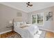 Bright bedroom featuring a queen bed, large window, neutral color palette, and stylish decor at 2453 Paul Nw Ave, Atlanta, GA 30318