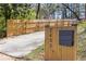 Driveway entrance with wooden fence and mailbox with home address at 2453 Paul Nw Ave, Atlanta, GA 30318