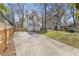 Charming two-story home with a spacious driveway and well-maintained lawn and neutral color scheme at 2453 Paul Nw Ave, Atlanta, GA 30318