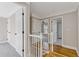 Bright hallway with white trim, hardwood floors, and doorways leading to various rooms at 2453 Paul Nw Ave, Atlanta, GA 30318