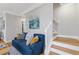 Cozy Living room with a blue sofa, hardwood floors, and staircase at 2453 Paul Nw Ave, Atlanta, GA 30318