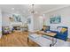 Spacious living room features hardwood floors, a fireplace, stylish furniture, and modern lighting at 2453 Paul Nw Ave, Atlanta, GA 30318