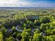 Expansive aerial view showcases the property's lush surroundings in Loganville, Georgia at 4085 Fawn Valley Dr, Loganville, GA 30052