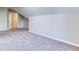 Attic space with neutral walls and carpeting, and one entry door at 4085 Fawn Valley Dr, Loganville, GA 30052