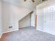 Bedroom with vaulted ceiling, neutral paint and carpeting, and two entry doors at 4085 Fawn Valley Dr, Loganville, GA 30052