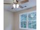 Bedroom showing a ceiling fan, double window, and neutral walls at 4085 Fawn Valley Dr, Loganville, GA 30052