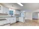 Kitchen features white cabinets, stainless steel appliances, granite countertops, and an island at 4085 Fawn Valley Dr, Loganville, GA 30052