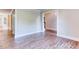 Bright, open-concept living area features light-colored walls and durable wood-look flooring at 4085 Fawn Valley Dr, Loganville, GA 30052