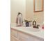 Close-up of the bathroom sink with a framed mirror and neutral paint at 1750 Clairmont Rd # 35, Decatur, GA 30033