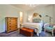 Bright bedroom with wooden furnishings, a comfortable bed, and tasteful decor at 1750 Clairmont Rd # 35, Decatur, GA 30033