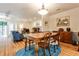 Cozy dining room with hardwood floors, a blue rug, and lots of light leading into an adjacent sitting room at 1750 Clairmont Rd # 35, Decatur, GA 30033
