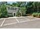 Charming townhome exterior with reserved parking spaces and landscaped yard at 1750 Clairmont Rd # 35, Decatur, GA 30033