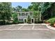 Charming townhome featuring reserved parking, a classic facade, and inviting curb appeal with mature landscaping at 1750 Clairmont Rd # 35, Decatur, GA 30033