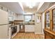 Traditional kitchen with white cabinets, neutral walls, and stainless appliances providing a functional cooking space at 1750 Clairmont Rd # 35, Decatur, GA 30033