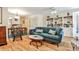 Bright living room features hardwood floors, a built-in bookcase, and a cozy sofa for relaxation at 1750 Clairmont Rd # 35, Decatur, GA 30033