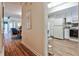Spacious living area transitioning to a kitchen, featuring hardwood floors and ample natural light at 1750 Clairmont Rd # 35, Decatur, GA 30033